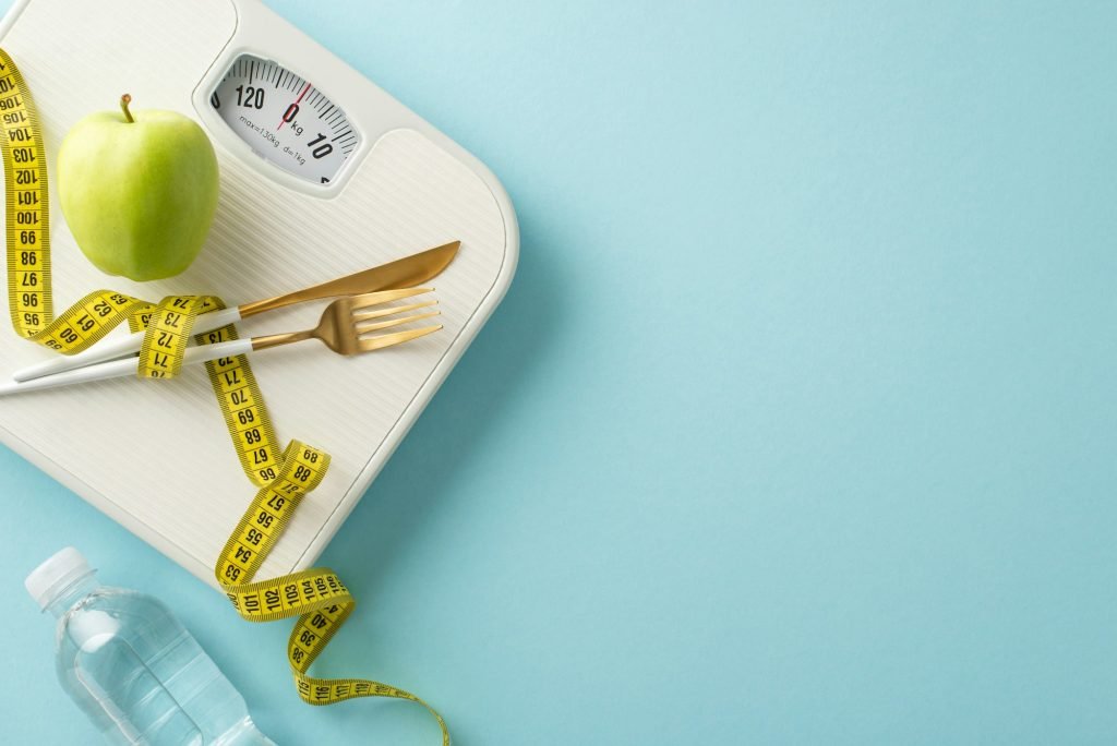 Fitness and Sculpting in Style Theme. Overhead shot of weight scale, measuring tape